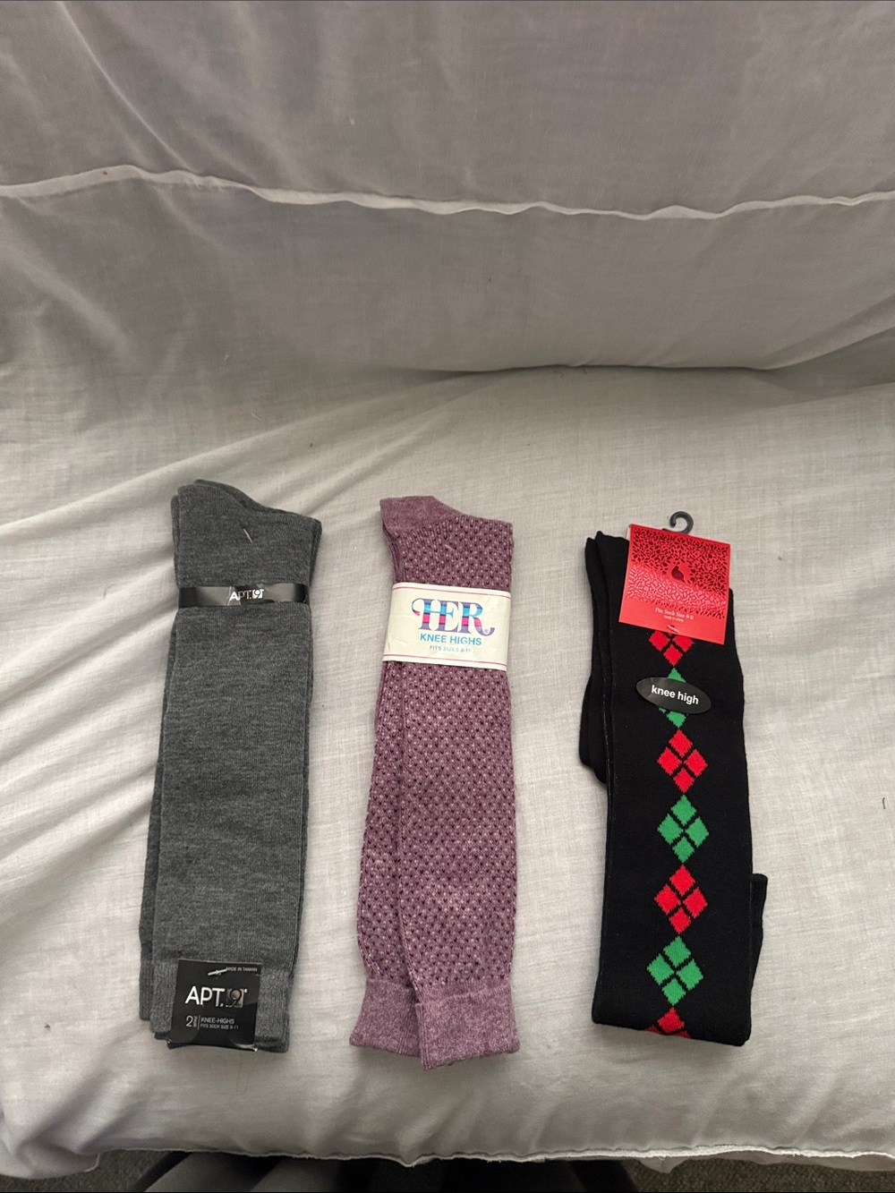 Women’s knee highs apt 9 gray 2 pair, her plum 1 pair, black 1 pair.  Size 9-11